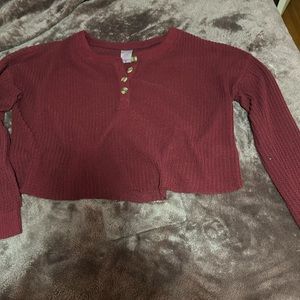 I’m selling this red top with buttons in a size  L if anyone is interested